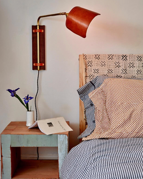 Sophisticated walnut, brass and leather plug in bedside  wall sconce with articulating arm and shade