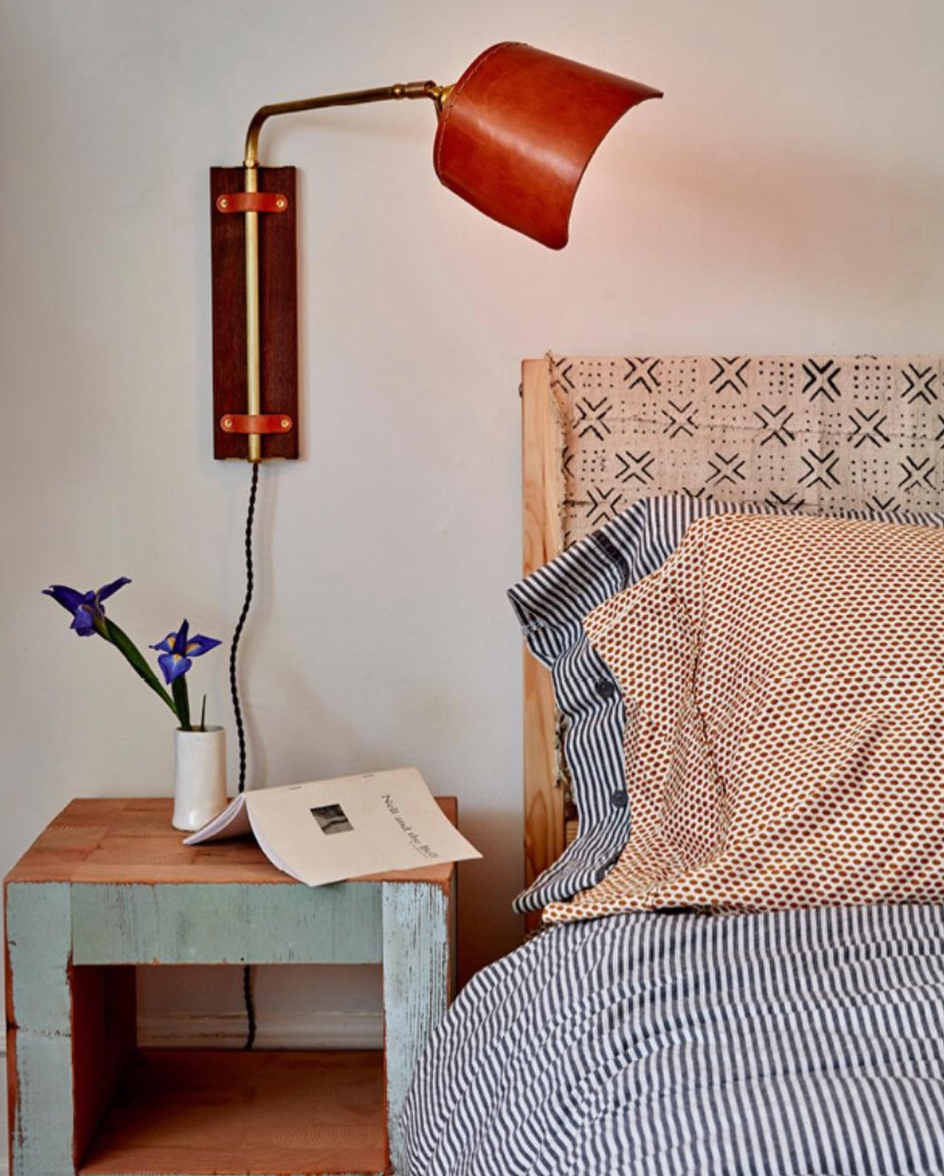 Sophisticated walnut, brass and leather plug in bedside  wall sconce with articulating arm and shade